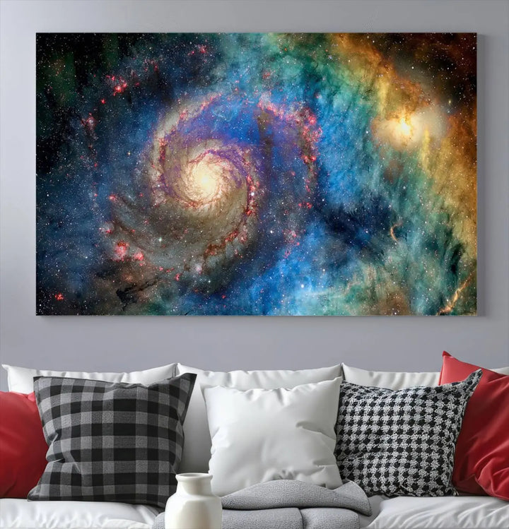 The living room showcases three colorful space-themed paintings titled "Spiral Galaxy Wall Art Canvas Print" on the wall, featuring museum-quality craftsmanship with vibrant colors through high-resolution printing.