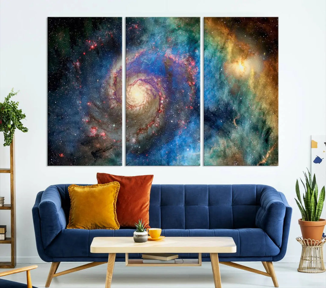 The living room showcases three colorful space-themed paintings titled "Spiral Galaxy Wall Art Canvas Print" on the wall, featuring museum-quality craftsmanship with vibrant colors through high-resolution printing.