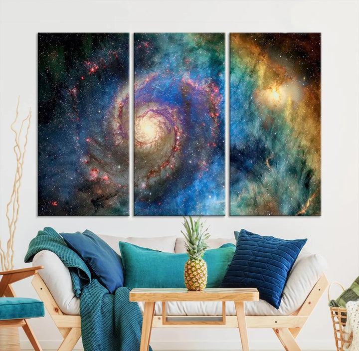 The living room showcases three colorful space-themed paintings titled "Spiral Galaxy Wall Art Canvas Print" on the wall, featuring museum-quality craftsmanship with vibrant colors through high-resolution printing.