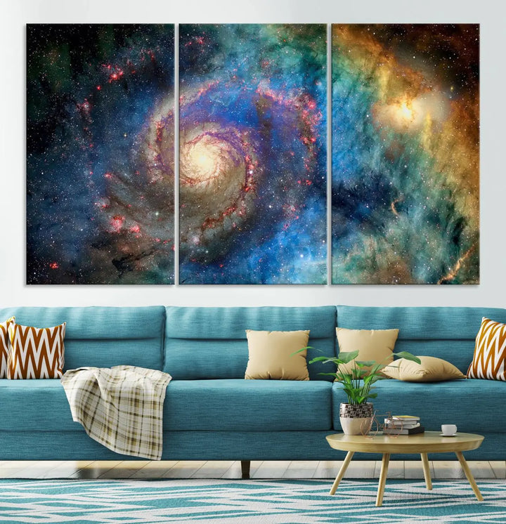 The living room showcases three colorful space-themed paintings titled "Spiral Galaxy Wall Art Canvas Print" on the wall, featuring museum-quality craftsmanship with vibrant colors through high-resolution printing.