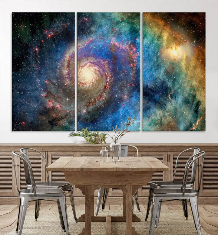 The living room showcases three colorful space-themed paintings titled "Spiral Galaxy Wall Art Canvas Print" on the wall, featuring museum-quality craftsmanship with vibrant colors through high-resolution printing.