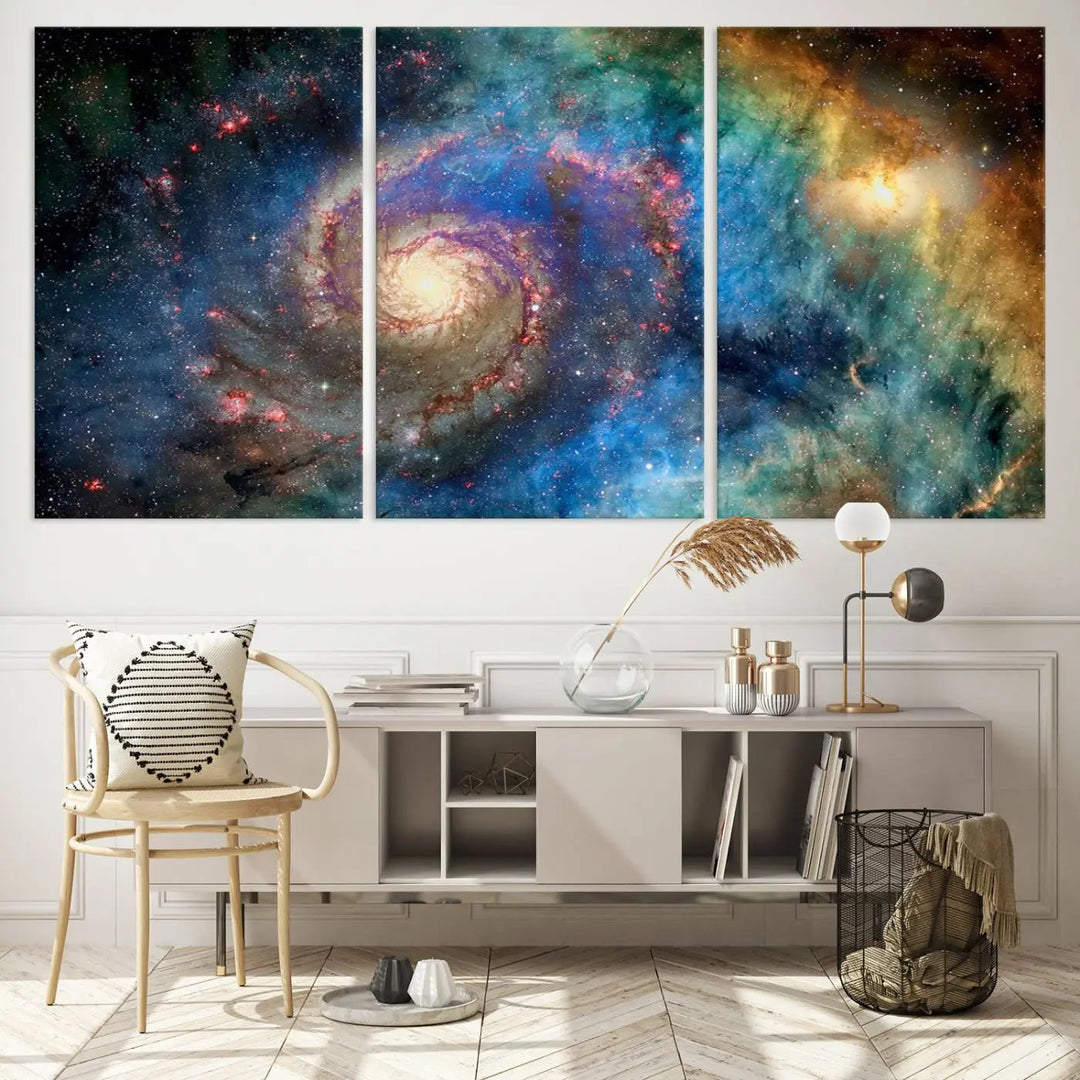 The living room showcases three colorful space-themed paintings titled "Spiral Galaxy Wall Art Canvas Print" on the wall, featuring museum-quality craftsmanship with vibrant colors through high-resolution printing.