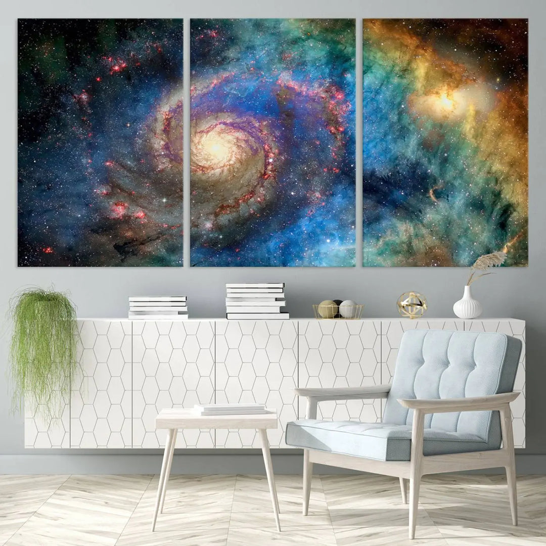 The living room showcases three colorful space-themed paintings titled "Spiral Galaxy Wall Art Canvas Print" on the wall, featuring museum-quality craftsmanship with vibrant colors through high-resolution printing.