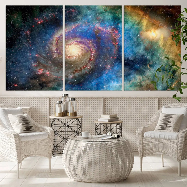 The living room showcases three colorful space-themed paintings titled "Spiral Galaxy Wall Art Canvas Print" on the wall, featuring museum-quality craftsmanship with vibrant colors through high-resolution printing.