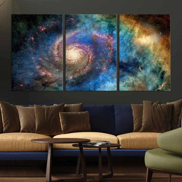 The living room showcases three colorful space-themed paintings titled "Spiral Galaxy Wall Art Canvas Print" on the wall, featuring museum-quality craftsmanship with vibrant colors through high-resolution printing.