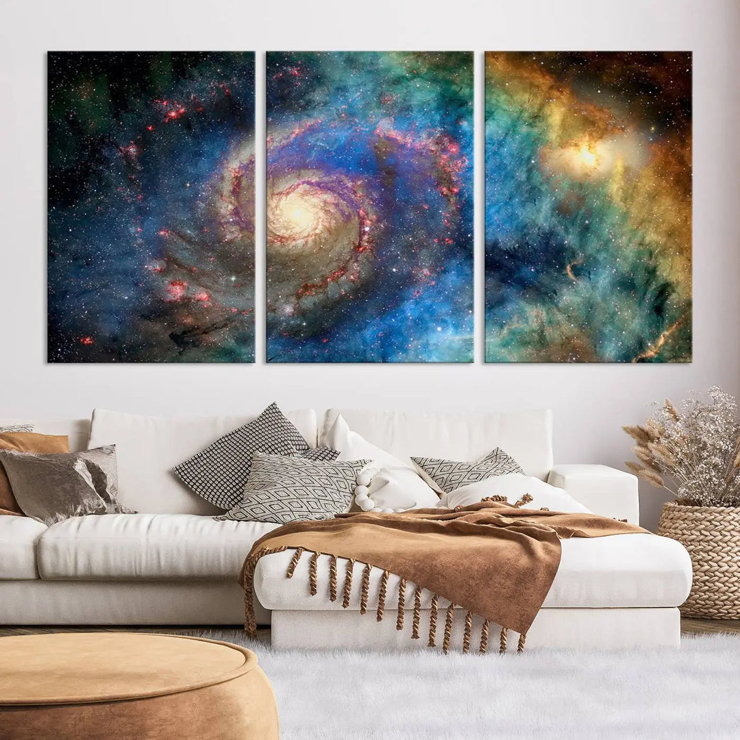 The living room showcases three colorful space-themed paintings titled "Spiral Galaxy Wall Art Canvas Print" on the wall, featuring museum-quality craftsmanship with vibrant colors through high-resolution printing.