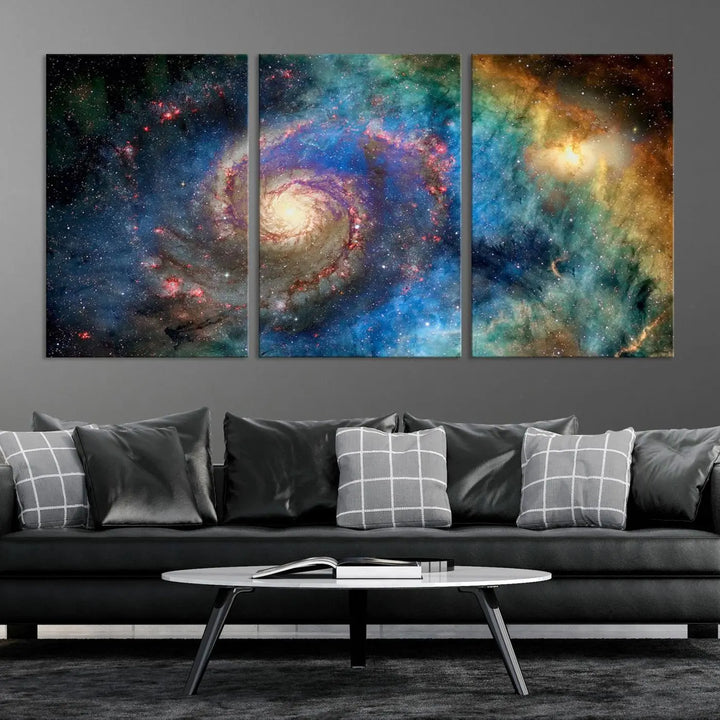 The living room showcases three colorful space-themed paintings titled "Spiral Galaxy Wall Art Canvas Print" on the wall, featuring museum-quality craftsmanship with vibrant colors through high-resolution printing.