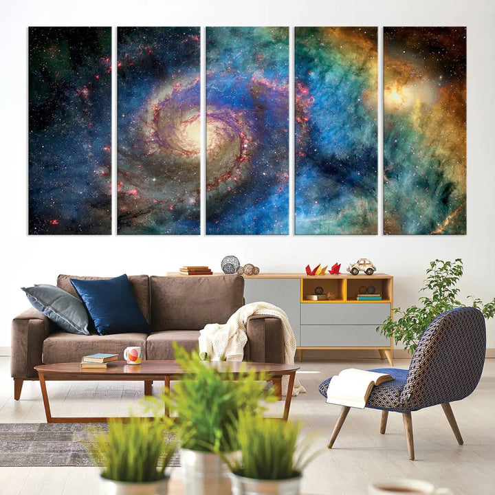 The living room showcases three colorful space-themed paintings titled "Spiral Galaxy Wall Art Canvas Print" on the wall, featuring museum-quality craftsmanship with vibrant colors through high-resolution printing.