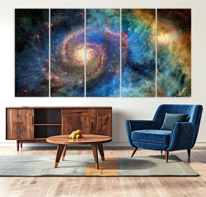 The living room showcases three colorful space-themed paintings titled "Spiral Galaxy Wall Art Canvas Print" on the wall, featuring museum-quality craftsmanship with vibrant colors through high-resolution printing.