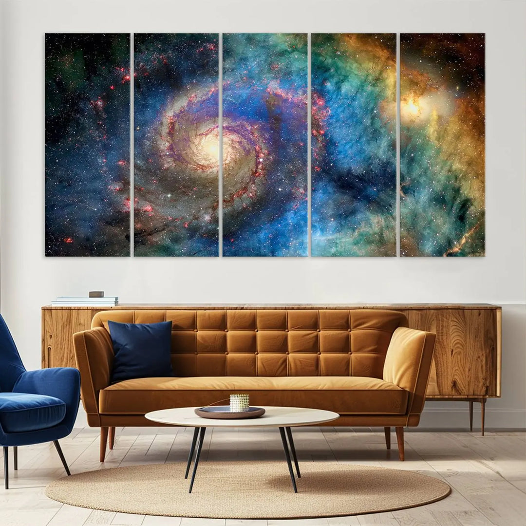 The living room showcases three colorful space-themed paintings titled "Spiral Galaxy Wall Art Canvas Print" on the wall, featuring museum-quality craftsmanship with vibrant colors through high-resolution printing.