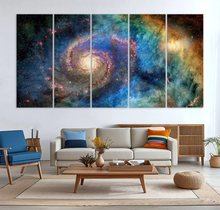 The living room showcases three colorful space-themed paintings titled "Spiral Galaxy Wall Art Canvas Print" on the wall, featuring museum-quality craftsmanship with vibrant colors through high-resolution printing.