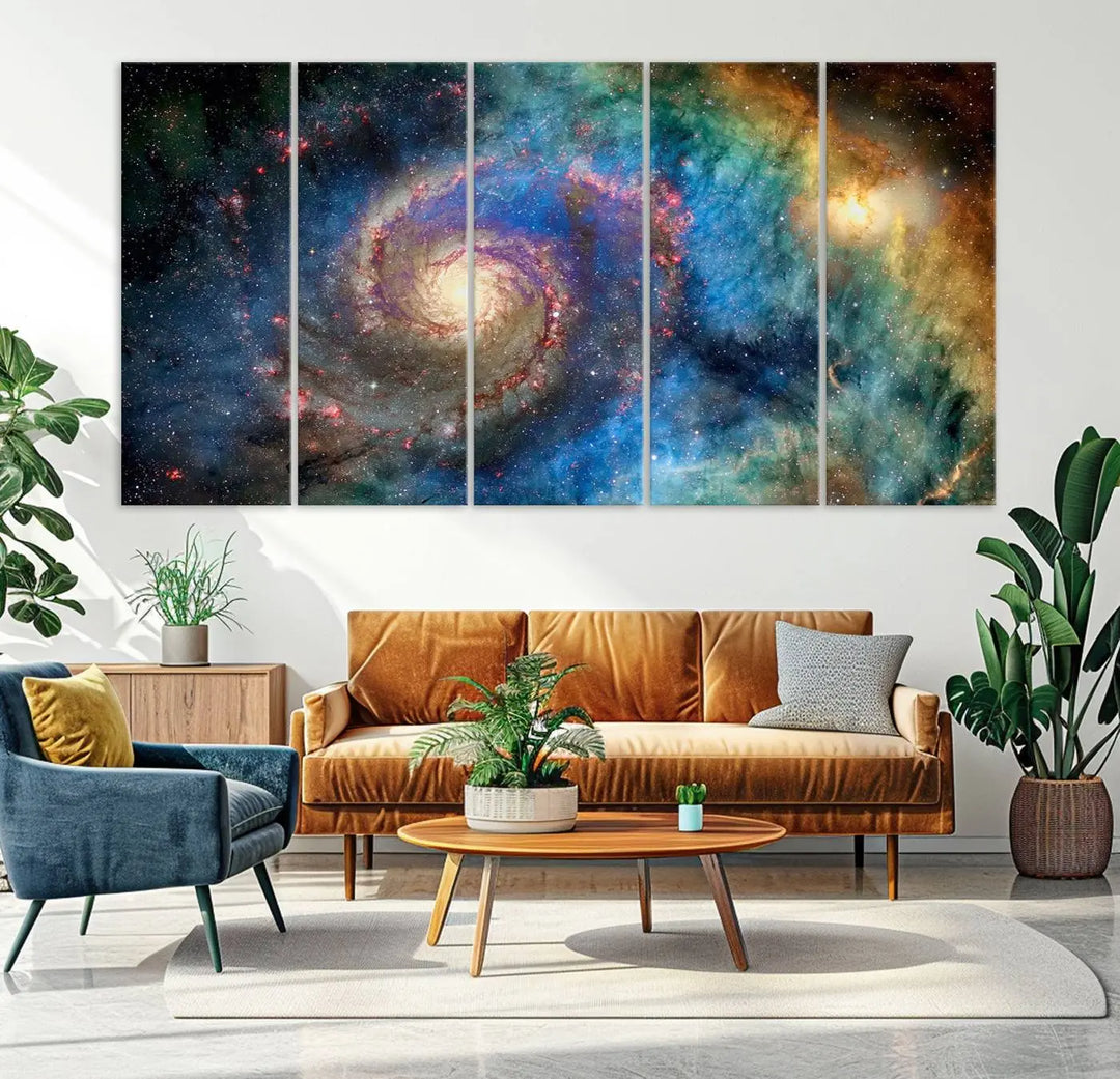 The living room showcases three colorful space-themed paintings titled "Spiral Galaxy Wall Art Canvas Print" on the wall, featuring museum-quality craftsmanship with vibrant colors through high-resolution printing.