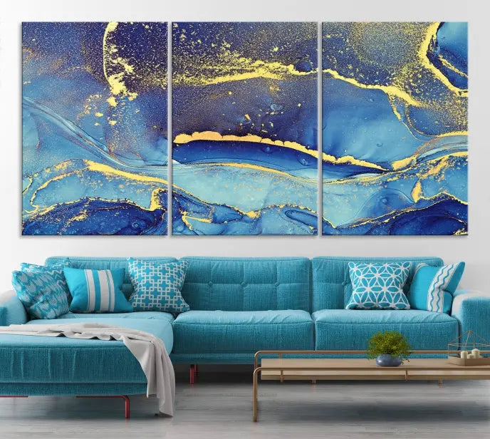 The "Splash Yellow Color Blue Marble Abstract Canvas Wall Art Print," featuring an abstract blue and gold design on museum-quality canvas with a UV-protective coating, elegantly adorns the wall. This ready-to-hang masterpiece effortlessly enhances the space.