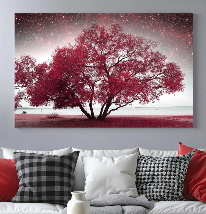 A living room adorned with a museum-quality triptych artwork on gallery-wrapped canvas titled "Spring Night Infrared Red Leaves and Tree," which showcases a pink tree against a starry sky.