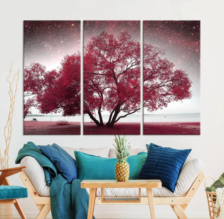 A living room adorned with a museum-quality triptych artwork on gallery-wrapped canvas titled "Spring Night Infrared Red Leaves and Tree," which showcases a pink tree against a starry sky.