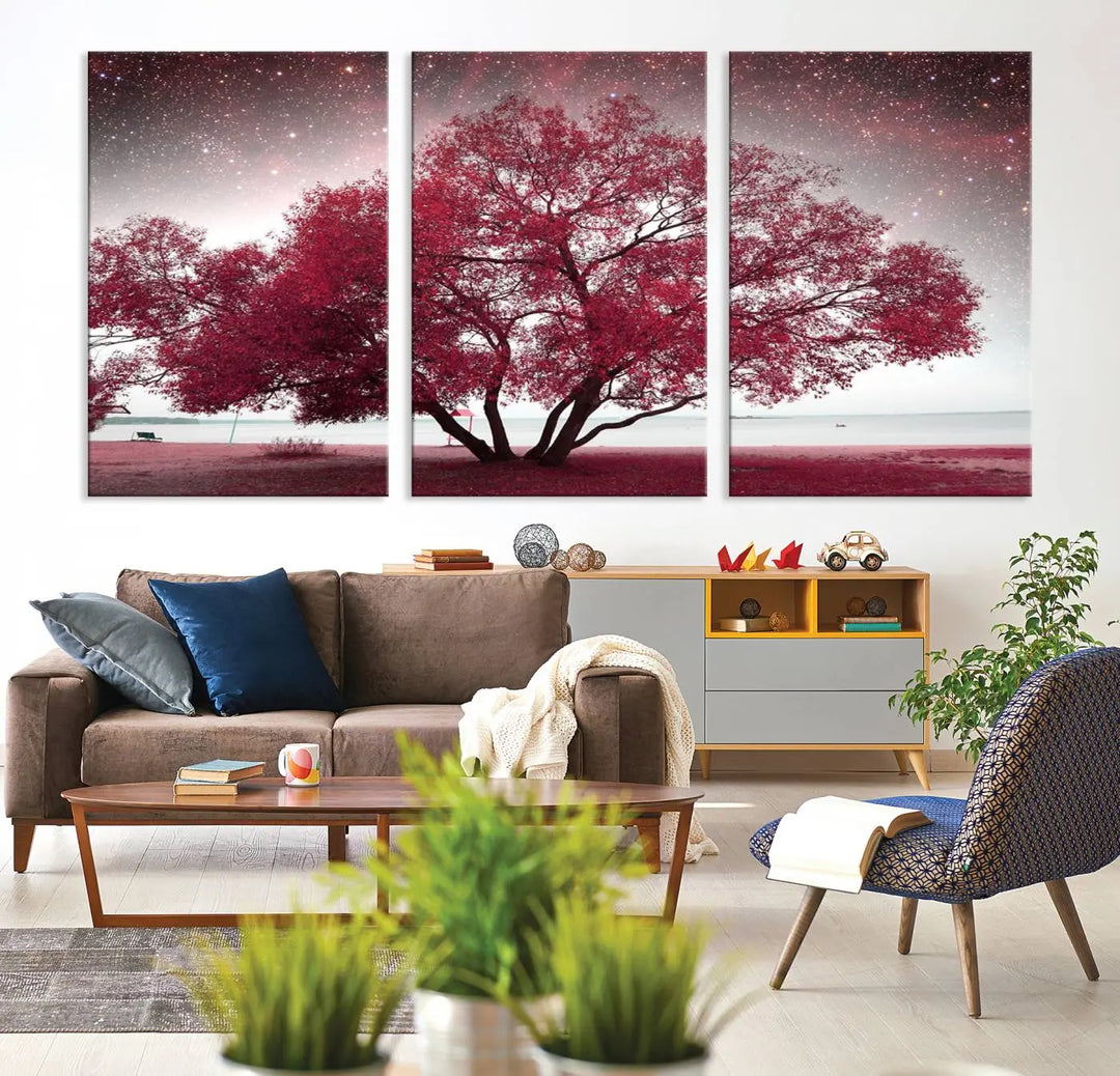 A living room adorned with a museum-quality triptych artwork on gallery-wrapped canvas titled "Spring Night Infrared Red Leaves and Tree," which showcases a pink tree against a starry sky.