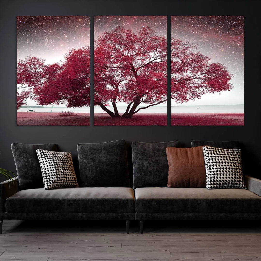 A living room adorned with a museum-quality triptych artwork on gallery-wrapped canvas titled "Spring Night Infrared Red Leaves and Tree," which showcases a pink tree against a starry sky.