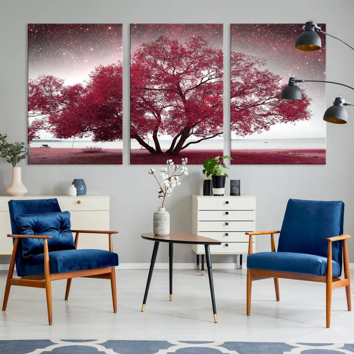 A living room adorned with a museum-quality triptych artwork on gallery-wrapped canvas titled "Spring Night Infrared Red Leaves and Tree," which showcases a pink tree against a starry sky.