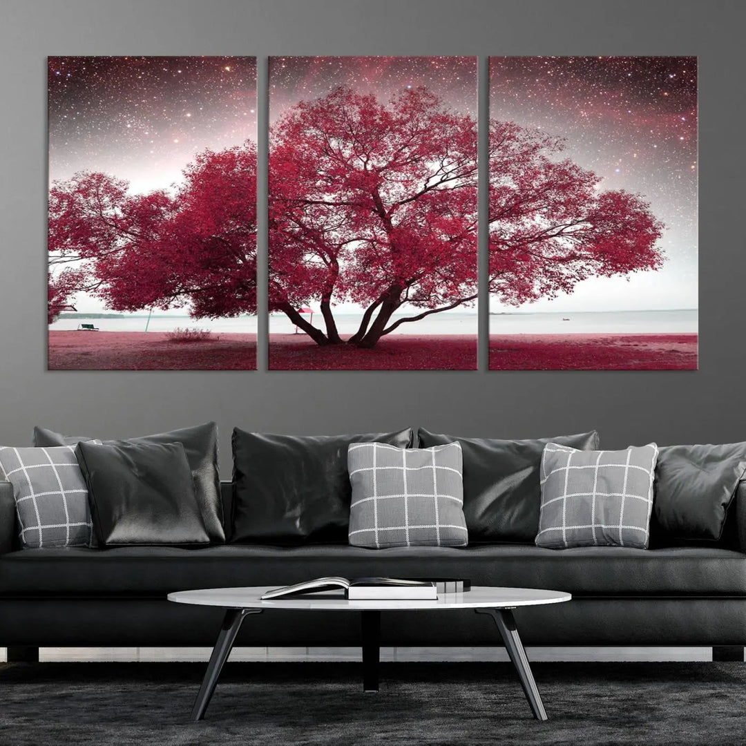 A living room adorned with a museum-quality triptych artwork on gallery-wrapped canvas titled "Spring Night Infrared Red Leaves and Tree," which showcases a pink tree against a starry sky.