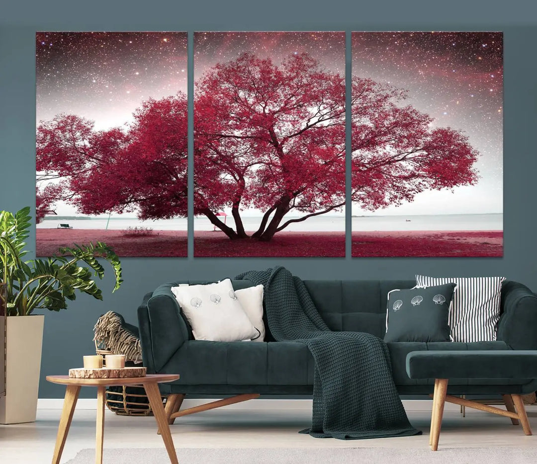 A living room adorned with a museum-quality triptych artwork on gallery-wrapped canvas titled "Spring Night Infrared Red Leaves and Tree," which showcases a pink tree against a starry sky.