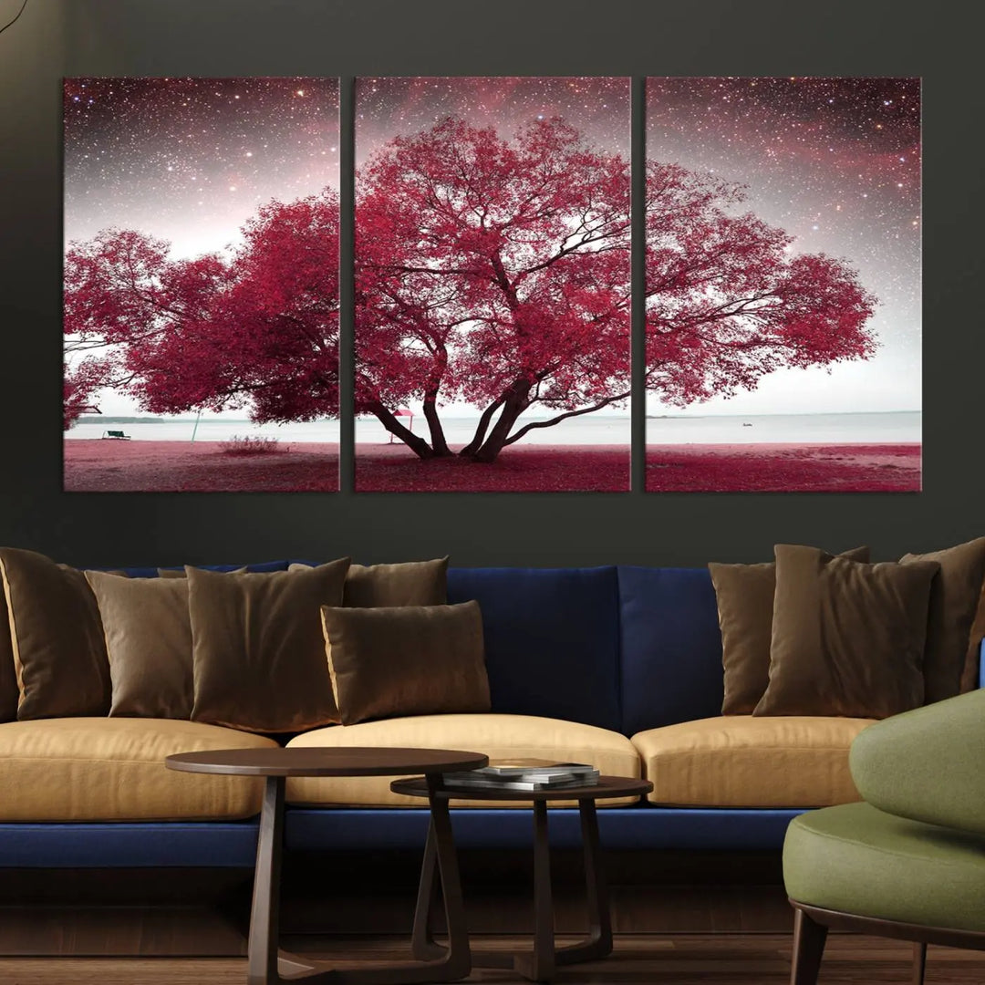 A living room adorned with a museum-quality triptych artwork on gallery-wrapped canvas titled "Spring Night Infrared Red Leaves and Tree," which showcases a pink tree against a starry sky.