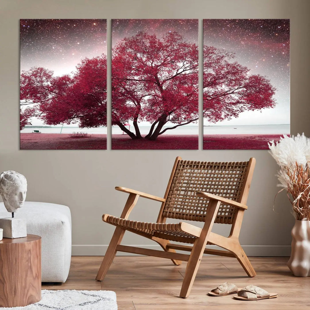 A living room adorned with a museum-quality triptych artwork on gallery-wrapped canvas titled "Spring Night Infrared Red Leaves and Tree," which showcases a pink tree against a starry sky.