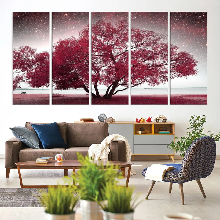 A living room adorned with a museum-quality triptych artwork on gallery-wrapped canvas titled "Spring Night Infrared Red Leaves and Tree," which showcases a pink tree against a starry sky.