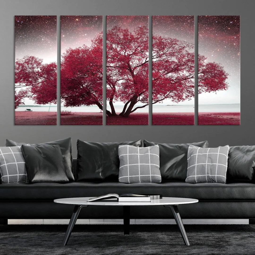 A living room adorned with a museum-quality triptych artwork on gallery-wrapped canvas titled "Spring Night Infrared Red Leaves and Tree," which showcases a pink tree against a starry sky.