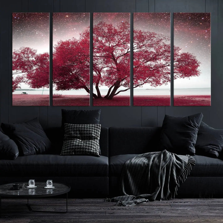 A living room adorned with a museum-quality triptych artwork on gallery-wrapped canvas titled "Spring Night Infrared Red Leaves and Tree," which showcases a pink tree against a starry sky.