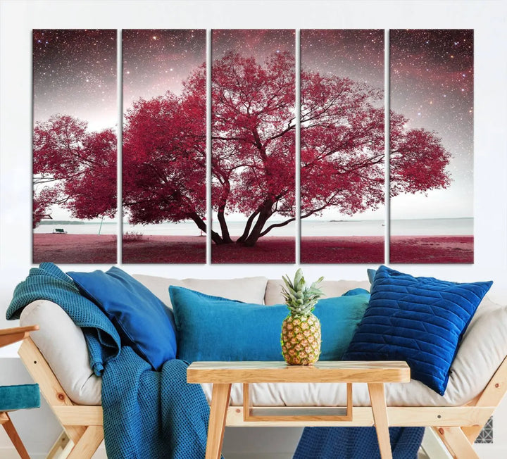 A living room adorned with a museum-quality triptych artwork on gallery-wrapped canvas titled "Spring Night Infrared Red Leaves and Tree," which showcases a pink tree against a starry sky.