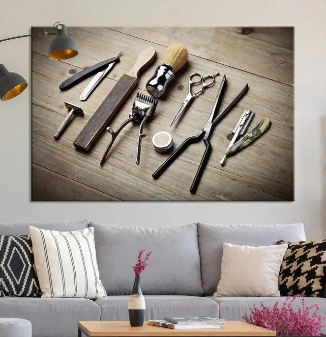 The Standart Barber Tools Wall Art Canvas Print features scissors, clippers, and brushes elegantly arranged on a wooden surface. This piece beautifully captures the essence of barber culture, adding a unique touch to any room.