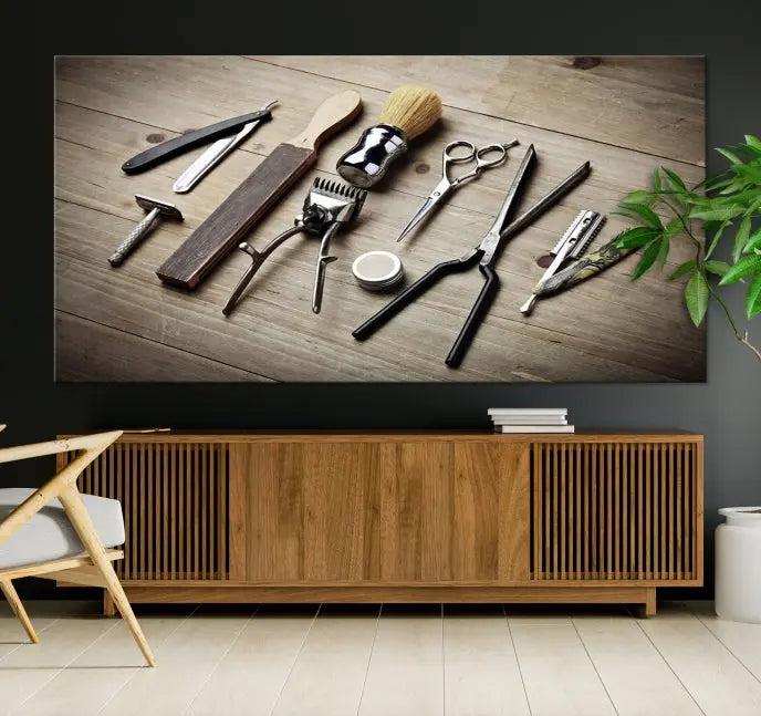 The Standart Barber Tools Wall Art Canvas Print features scissors, clippers, and brushes elegantly arranged on a wooden surface. This piece beautifully captures the essence of barber culture, adding a unique touch to any room.