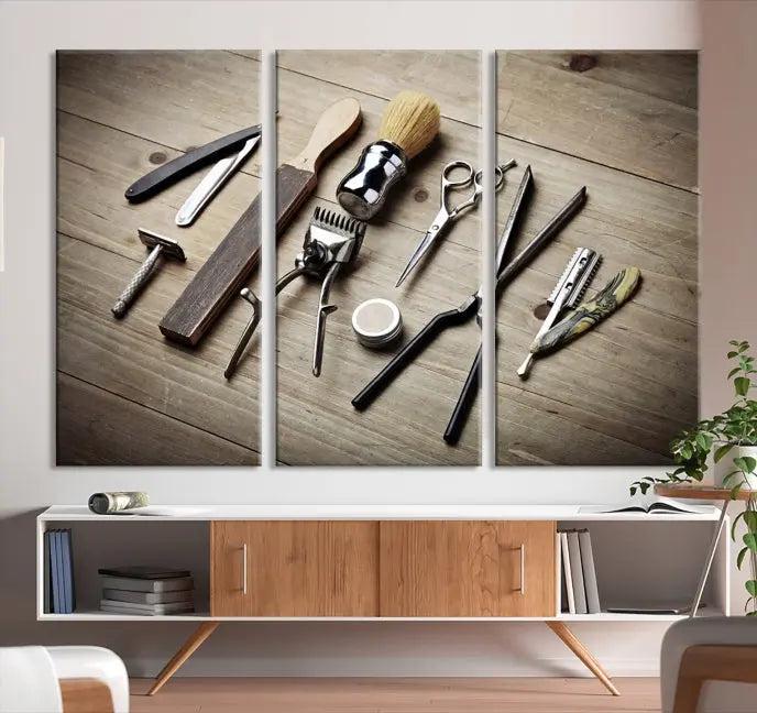 The Standart Barber Tools Wall Art Canvas Print features scissors, clippers, and brushes elegantly arranged on a wooden surface. This piece beautifully captures the essence of barber culture, adding a unique touch to any room.