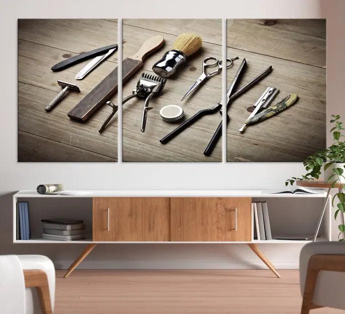 The Standart Barber Tools Wall Art Canvas Print features scissors, clippers, and brushes elegantly arranged on a wooden surface. This piece beautifully captures the essence of barber culture, adding a unique touch to any room.