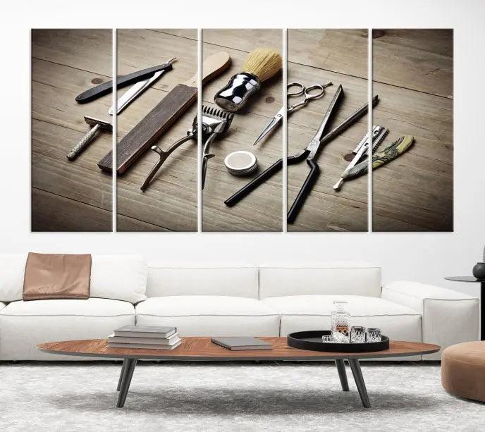 The Standart Barber Tools Wall Art Canvas Print features scissors, clippers, and brushes elegantly arranged on a wooden surface. This piece beautifully captures the essence of barber culture, adding a unique touch to any room.