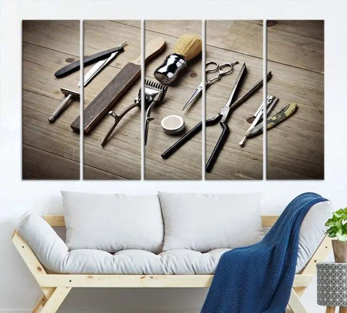 The Standart Barber Tools Wall Art Canvas Print features scissors, clippers, and brushes elegantly arranged on a wooden surface. This piece beautifully captures the essence of barber culture, adding a unique touch to any room.