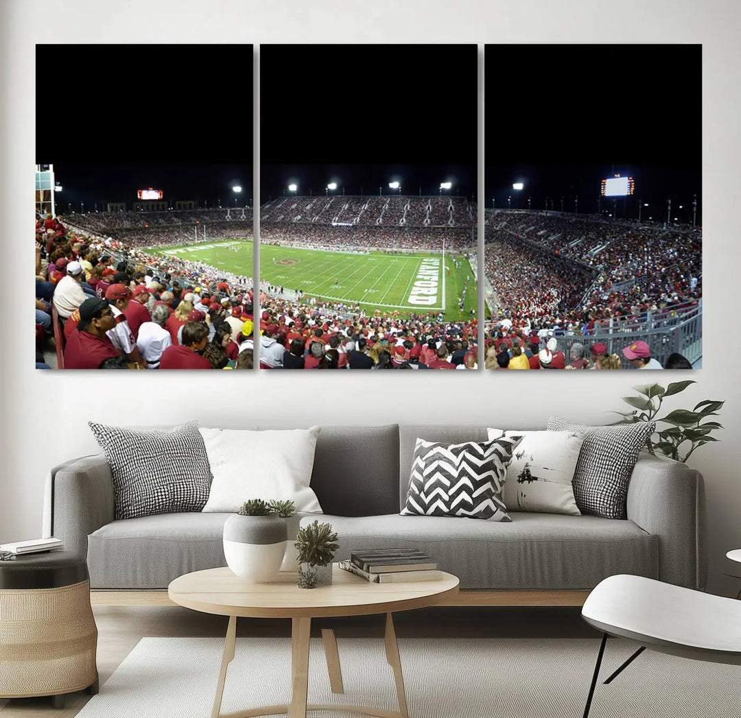 The living room features a large triptych wall art crafted on premium canvas, showcasing the "Stanford University Cardinal Football Team Print - Stanford Stadium," which depicts a crowded football stadium at night. Handmade in the USA.