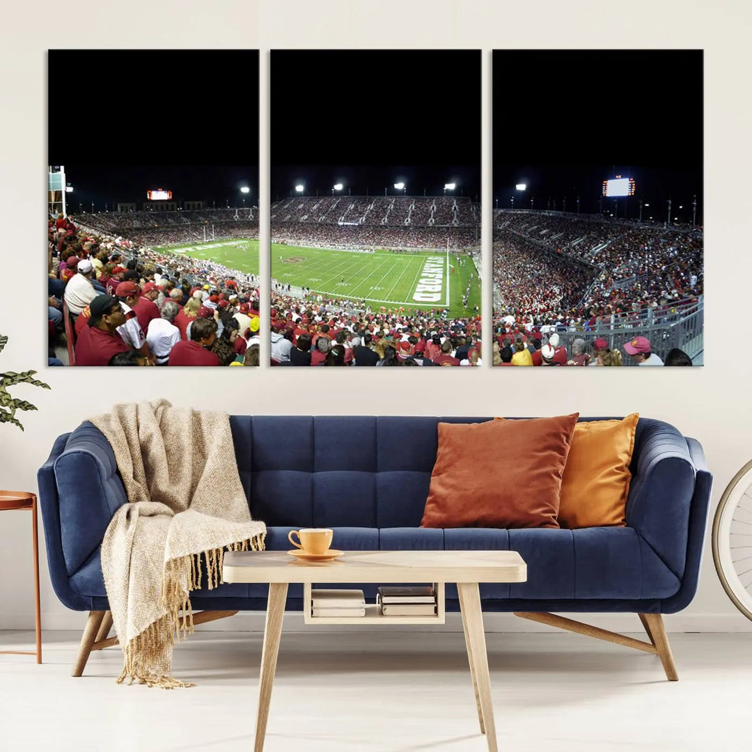 The living room features a large triptych wall art crafted on premium canvas, showcasing the "Stanford University Cardinal Football Team Print - Stanford Stadium," which depicts a crowded football stadium at night. Handmade in the USA.