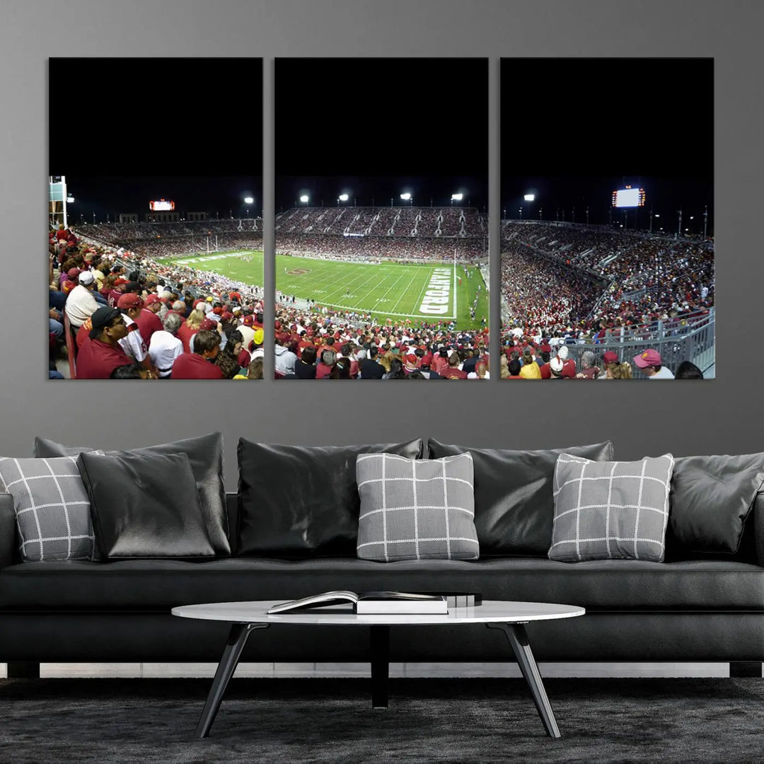 The living room features a large triptych wall art crafted on premium canvas, showcasing the "Stanford University Cardinal Football Team Print - Stanford Stadium," which depicts a crowded football stadium at night. Handmade in the USA.