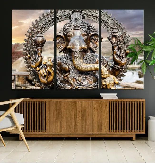 A Statue of Hindu Elephant God Ganesha Wall Art Canvas Print features a museum-quality canvas with a UV-protective coating and is ready to hang against a dark wall.