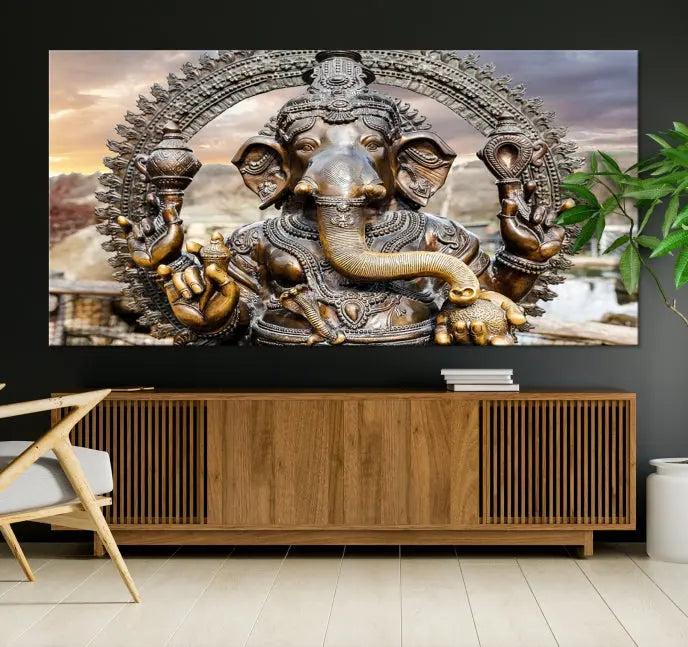 A Statue of Hindu Elephant God Ganesha Wall Art Canvas Print features a museum-quality canvas with a UV-protective coating and is ready to hang against a dark wall.