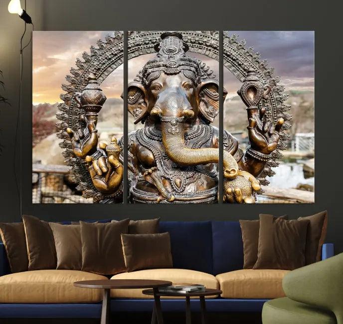 A Statue of Hindu Elephant God Ganesha Wall Art Canvas Print features a museum-quality canvas with a UV-protective coating and is ready to hang against a dark wall.