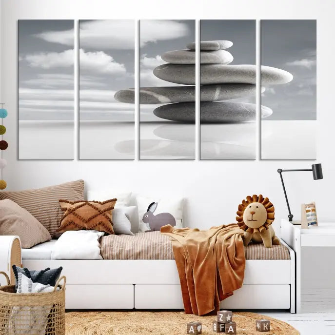 A gallery-quality Still Life Black and White Zen Stones Wall Art Canvas Print, featuring a triptych of stacked stones against a calm, cloudy background, adorns the room to bring an elegant touch.