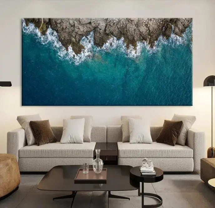 The wall is adorned with the Stone and Aerial Beach Wall Art Canvas Print, crafted by professional artisans, contributing an air of sophistication to the space.