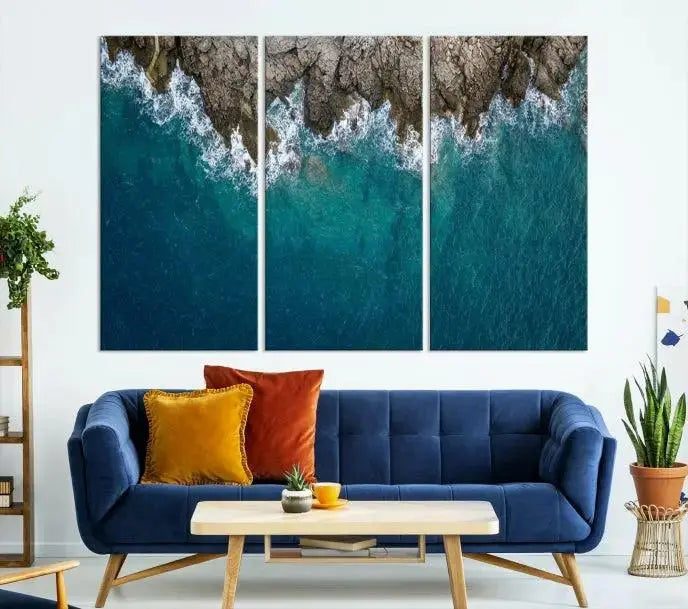 The wall is adorned with the Stone and Aerial Beach Wall Art Canvas Print, crafted by professional artisans, contributing an air of sophistication to the space.