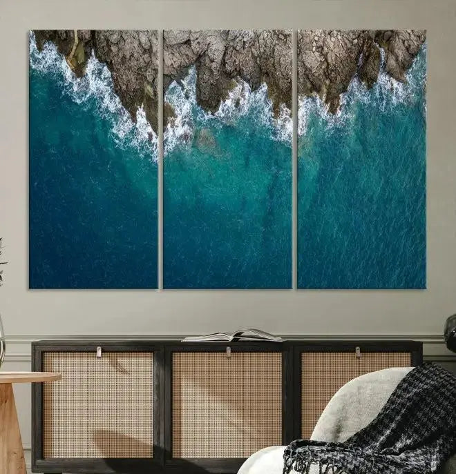 The wall is adorned with the Stone and Aerial Beach Wall Art Canvas Print, crafted by professional artisans, contributing an air of sophistication to the space.