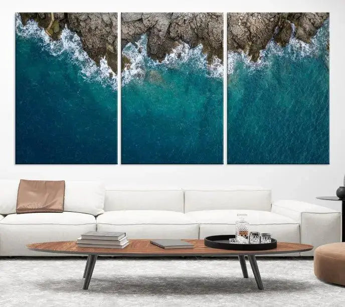 The wall is adorned with the Stone and Aerial Beach Wall Art Canvas Print, crafted by professional artisans, contributing an air of sophistication to the space.