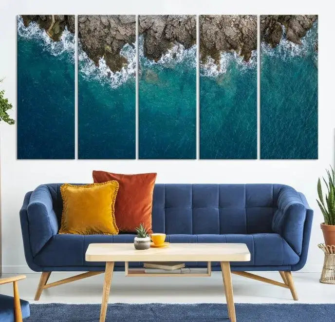 The wall is adorned with the Stone and Aerial Beach Wall Art Canvas Print, crafted by professional artisans, contributing an air of sophistication to the space.