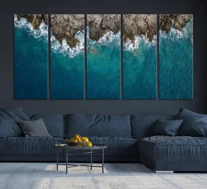 The wall is adorned with the Stone and Aerial Beach Wall Art Canvas Print, crafted by professional artisans, contributing an air of sophistication to the space.