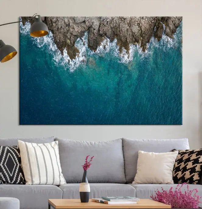 The wall is adorned with the Stone and Aerial Beach Wall Art Canvas Print, crafted by professional artisans, contributing an air of sophistication to the space.